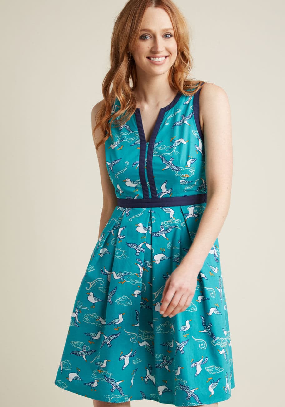 MCD1486 - It's your 'anything goes' attitude toward fashion that led you to this teal dress, for it's the details that make it feel entirely your own! A part of our ModCloth namesake label, this cotton number hits each point of your ensemble criteria with its notch