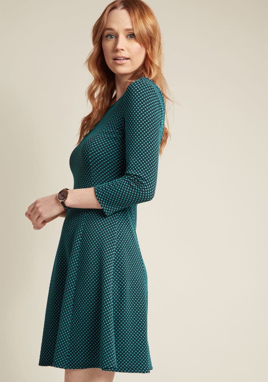 MCD1497 - What do you know about print mixing? Judging from your plans to style this stretch-knit skater dress, you know an awful lot! Part of our ModCloth namesake label, this 3/4-sleeved number uses its black hue to present a textured series of teal dots on its s