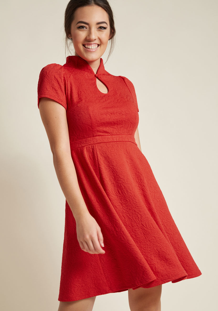 MCD1498 - Proclaim your savvy for being a socialite by sporting this red dress. Part of our ModCloth namesake label, this '50s-inspired frock is an elevated pick that adds beau-monde style to your wardrobe with its buttoned keyhole closure, slightly puffed sleeves,