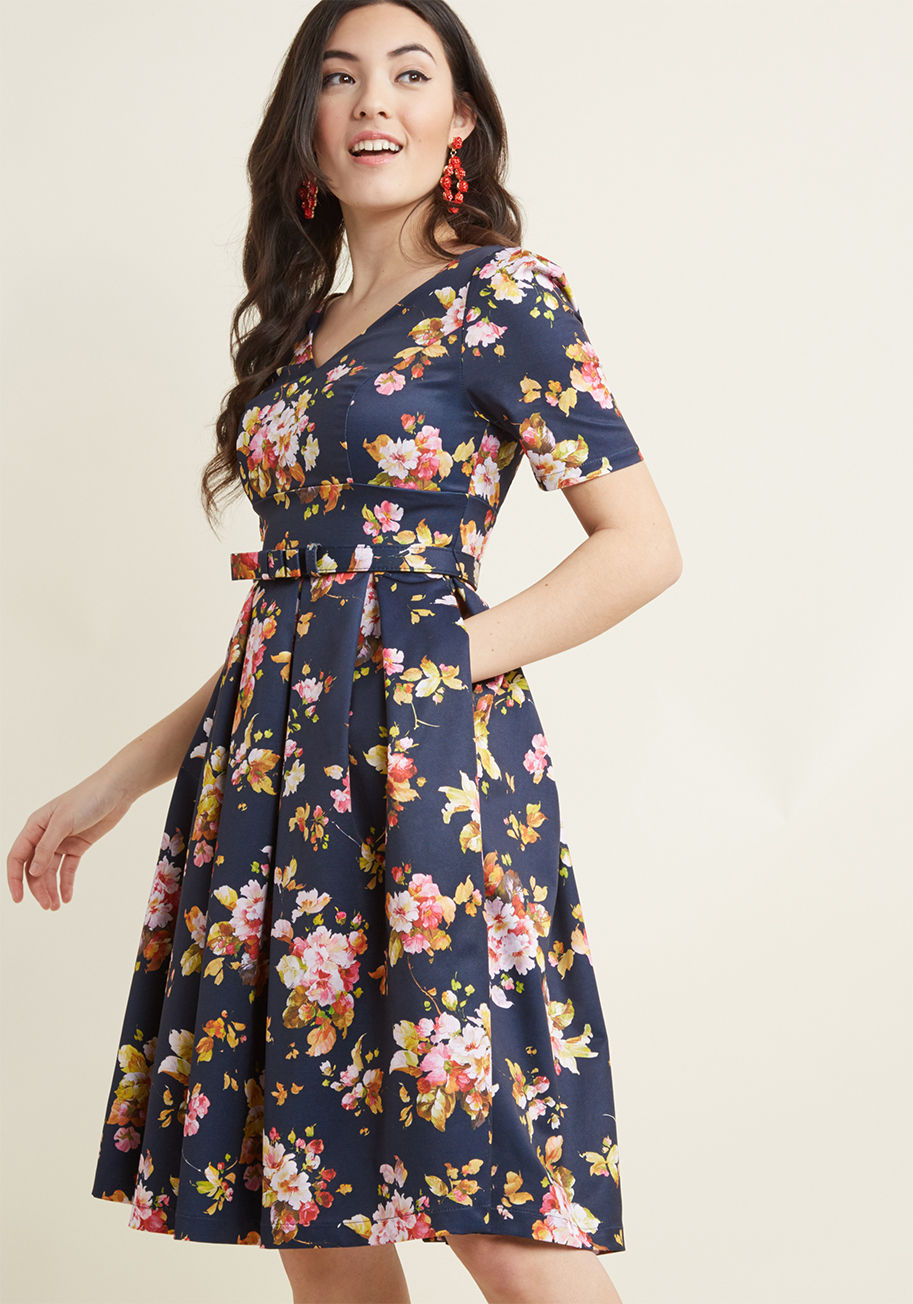 MCD1513 - If ever there's a debate on what exemplifies urbanity, you refer to this navy fit and flare from our ModCloth namesake label. The subtly-puffed shoulders atop half sleeves, tailored bodice, bow-detailed belt, hidden pockets, and crisp pleats of this grosg