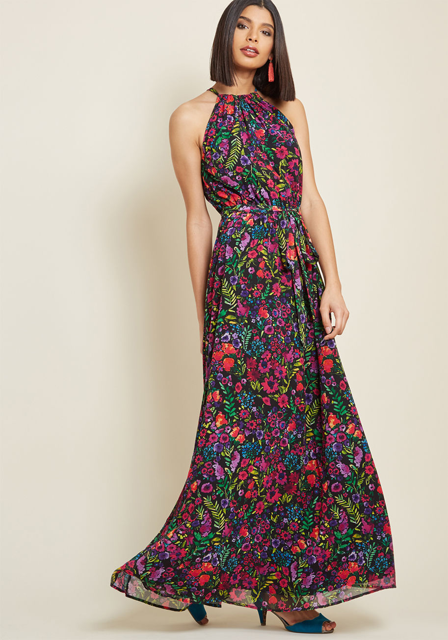 MCD1519 - Nothing can rival your glow, but this black maxi dress from our ModCloth namesake label sure comes close! Enlightening the area with its vibrant magenta, green, and orange florals, this high-neckline gown flaunts a tied back keyhole, a sash topping its el