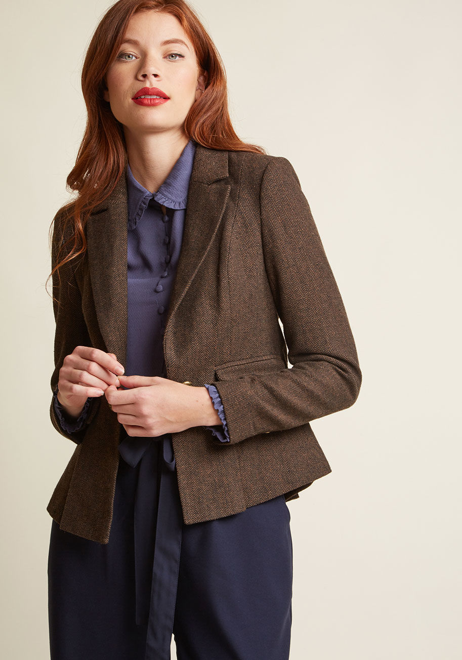 MCO1077 - When the perfect finishing touch to your look seems elusive as ever, turn your attention to this brown blazer from our ModCloth namesake label. Solving all your style mysteries with its herringbone fabric, crisp lapels, gold buttons, and peplum-style hem,