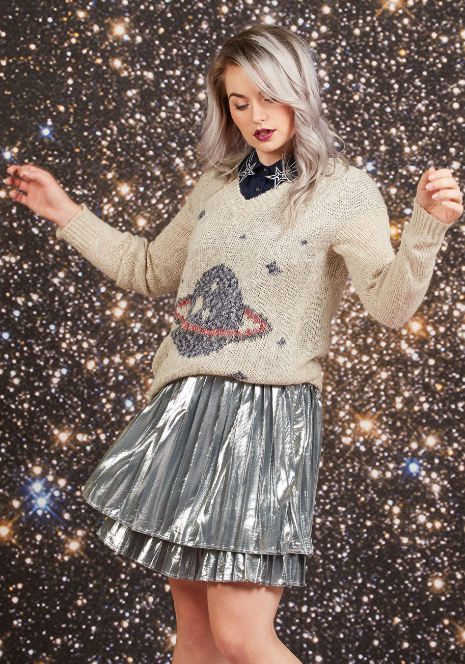 MCS1037 - Your attraction to this V-neck sweater isn't scientific - it's organic! Adoring its navy, charcoal, and red intarsia of Saturn and stars comes naturally, especially once you feel how soft its semi-sheer knit is against your skin. With a tunic length and a