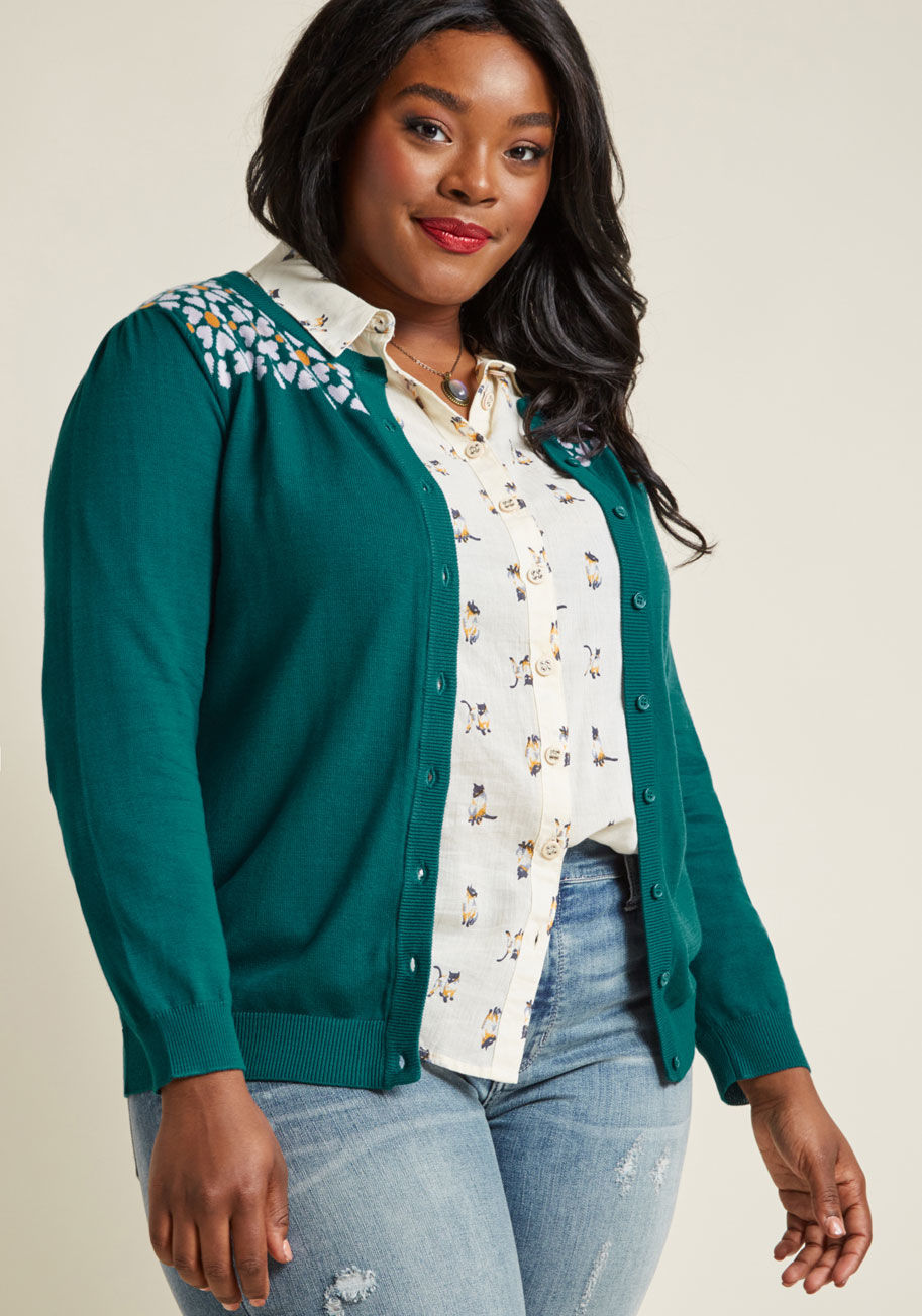 MCS1141 - While some believe there's nothing better than a solid button-up sweater, we challenge that notion with the details of this cardigan from our ModCloth namesake label! Amplifying the rich teal hue of this lively layer are fun flowers with lilac petals and 