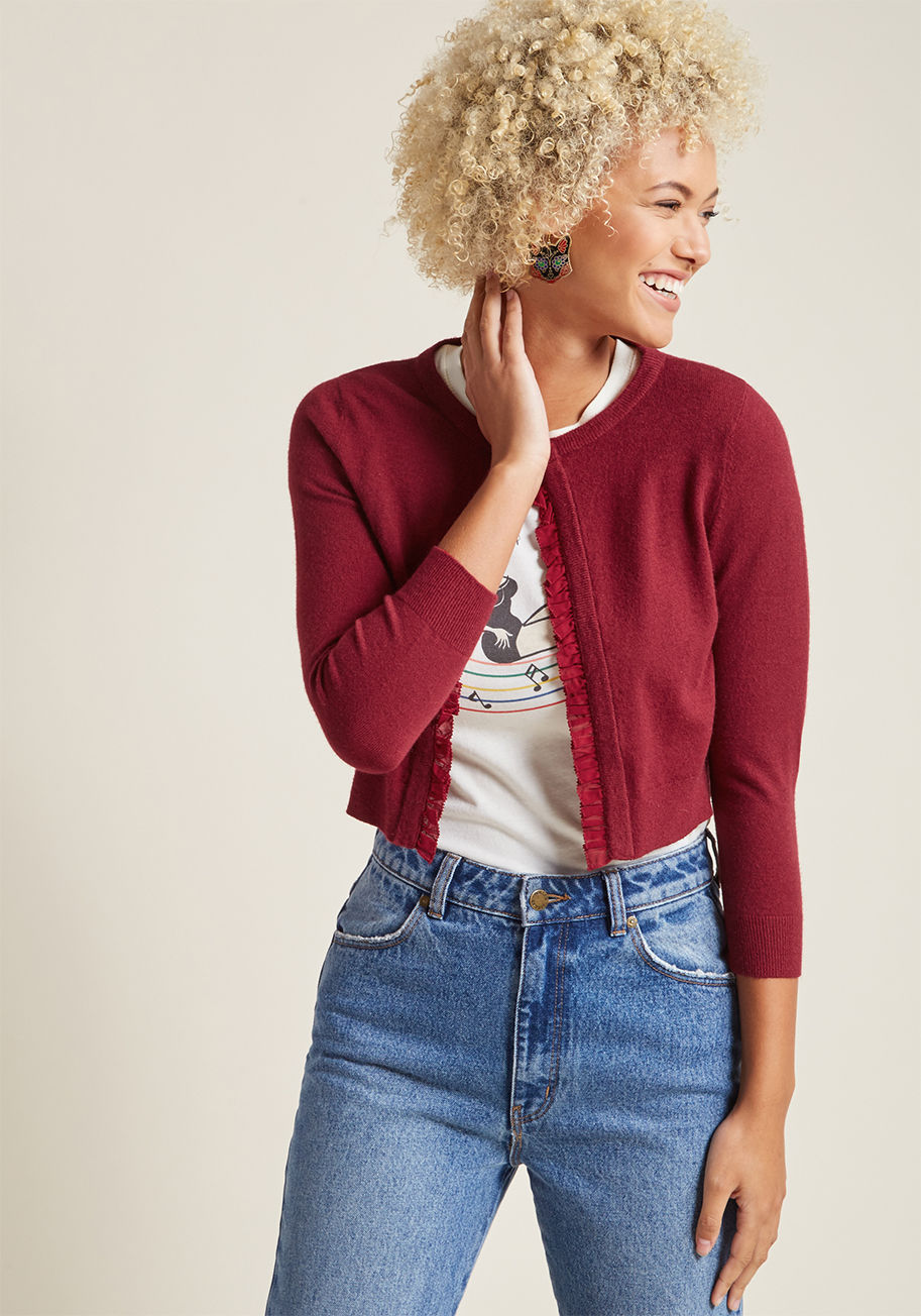 Mcs1154 - The perfect topper to the ultimate ensemble? Why, it's this ruby red cardigan, of course! Part of our ModCloth namesake label, this super-soft cardi features a delicate ruffled trim, a single button closure, and a cropped cut, all of which provide a class