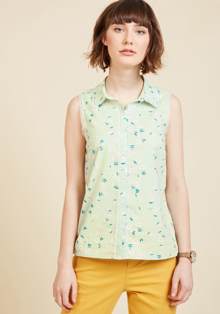 MCT1100B - That smile that forms when you're feeling confident? This pastel green blouse will keep it going strong! Polished with a peppy collar, a daisy print, and delicate lace trim, this cotton button up from our ModCloth namesake label brings out your best self.