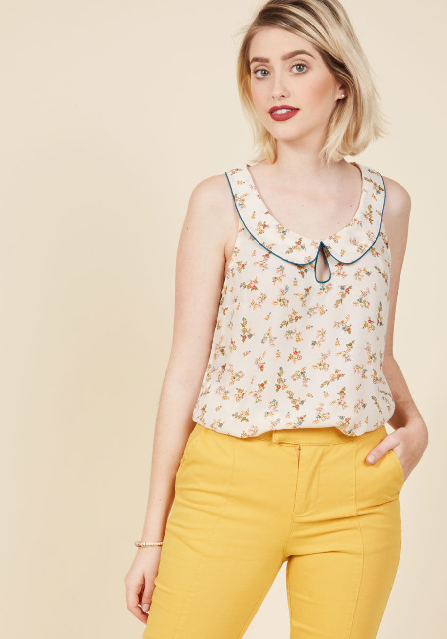 MCT1123B - With your dreamy fashion sense, envisioning your ideal ensemble is an all-day affair. This ivory blouse from our ModCloth namesake label brings those sartorial fantasies to life with its navy-trimmed Peter Pan collar, sweet keyhole, and delicate floral pr