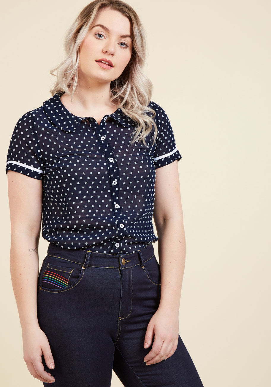 MCT1182 - Beginning your outfit with this navy blouse from our ModCloth namesake label ensures the day ahead will brim with confidence and class! Topped with white Swiss dots from its rounded collar, to its navy-trimmed cuffs, down to its hem, this sheer button up 