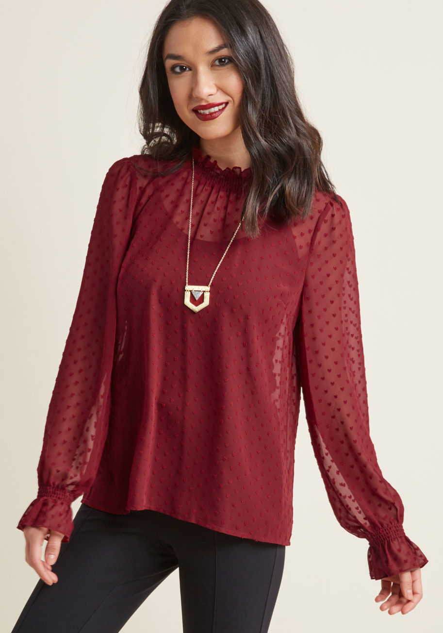 MCT1499 - How's about a romantic blouse for your next dinner date? This style from our ModCloth namesake label flaunts endearing vintage-inspired details, like smocking at its high neckline and long sleeve cuffs, textured hearts patterned all over, and a blissful b