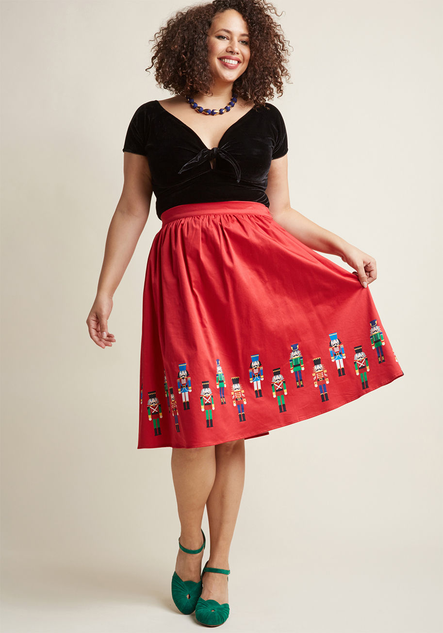 MDB1006A - Get ready, get set, get full-on festive with this red skirt from our ModCloth namesake label! A high waistline, hidden pockets, and a border print of classic nutcrackers contribute to the retro vibe of this adorable A-line, whose overall aesthetic activat