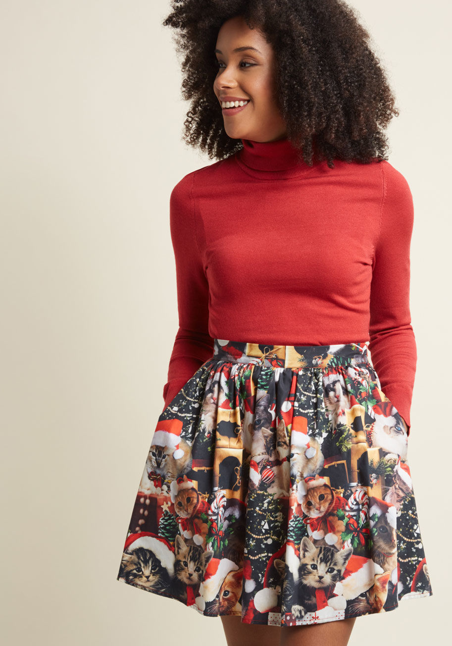 MDB1035A - Here comes Santa Paws, here comes Santa Paws - right on top of this skater skirt from our ModCloth namesake label! Though the quirky design of this cotton A-line needs no introduction, it's festive, photorealistic kitties and motif of gifts, trees, and or