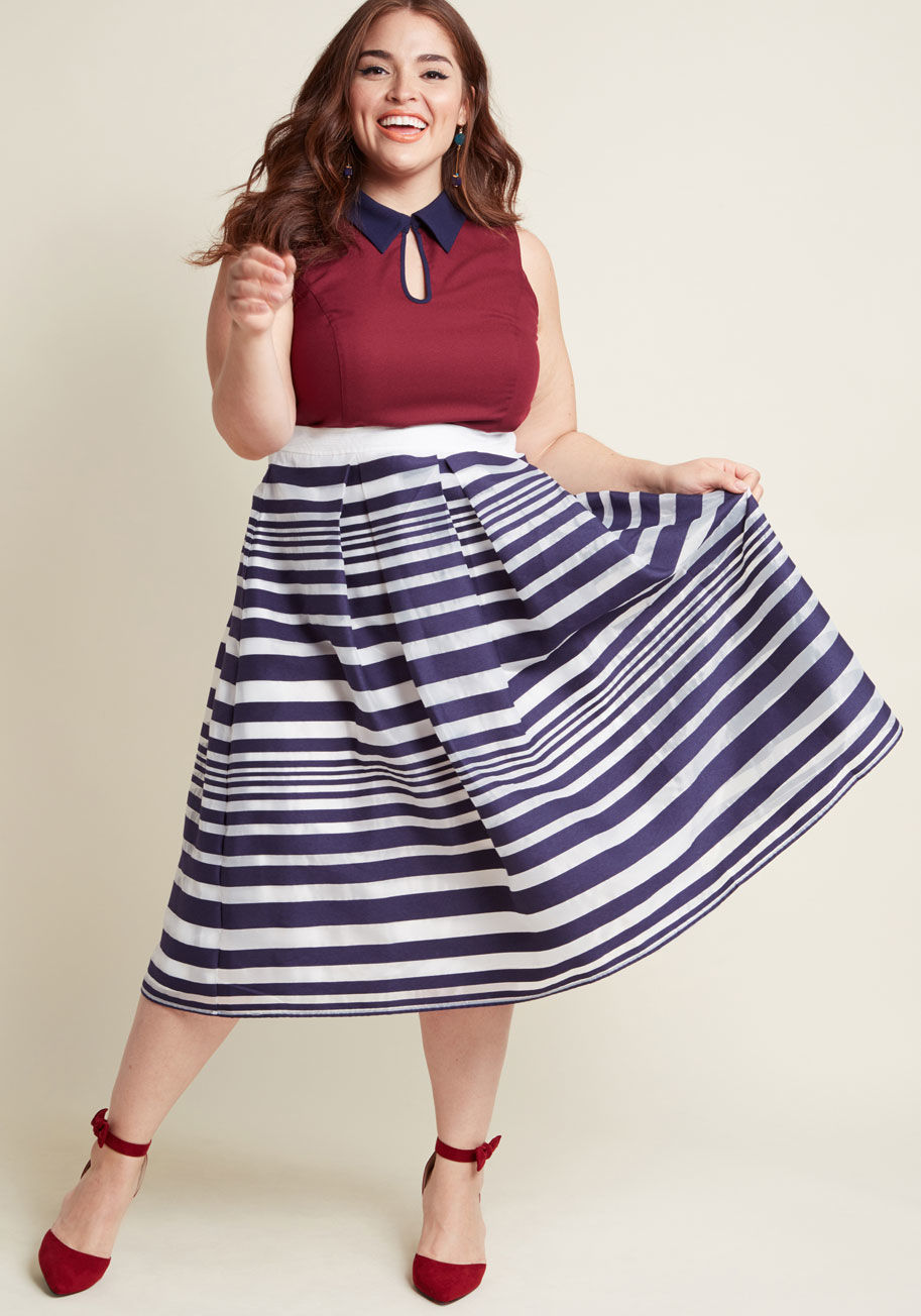 MDB1057 - At last, the event has arrived, and you couldn't be more excited to debut this striped skirt from our ModCloth namesake label! The high waist atop subtle pleats, alternating sections of opaque navy and sheer white, and satiny lining of this full, vintage-