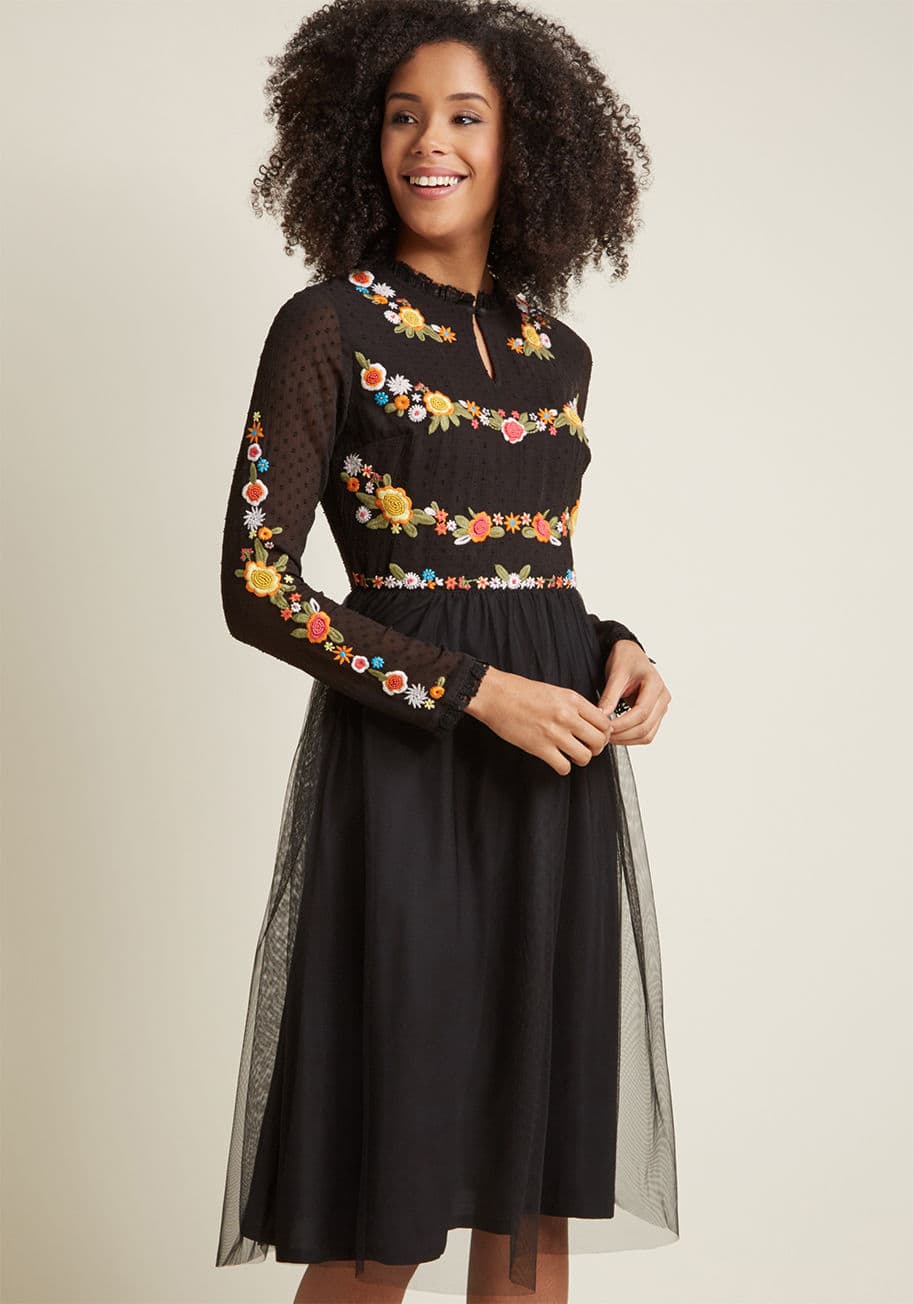 MDD1190 - It's your choice to start your story with this black midi dress - a marvelous ModCloth exclusive. How it unfolds is up to fate! Surely, the beaded, embroidered flowers coloring this long-sleeved frock will come into play, as will the ruffled lace accentin