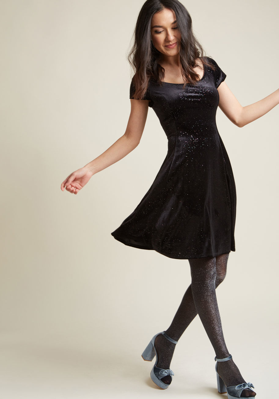 mdd1192 - Layer it up or let it shine on its own - whatever your fashion mood, this black velvet skater dress will spark a feel-good day! Designed with a scoop neckline, short sleeves, princess seams, and smattering of rainbow sparkles, this ModCloth-exclusive mini