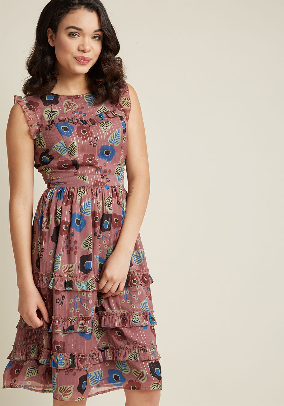 MDD1194 - Give your look an extra sprinkle of sparkle by opting to flaunt this floral dress from our ModCloth namesake label! A subtle mauve hue sets the stage for this chiffon frock's metallic gold threads and ruffles at the arms, bust, and skirt to shine, making 