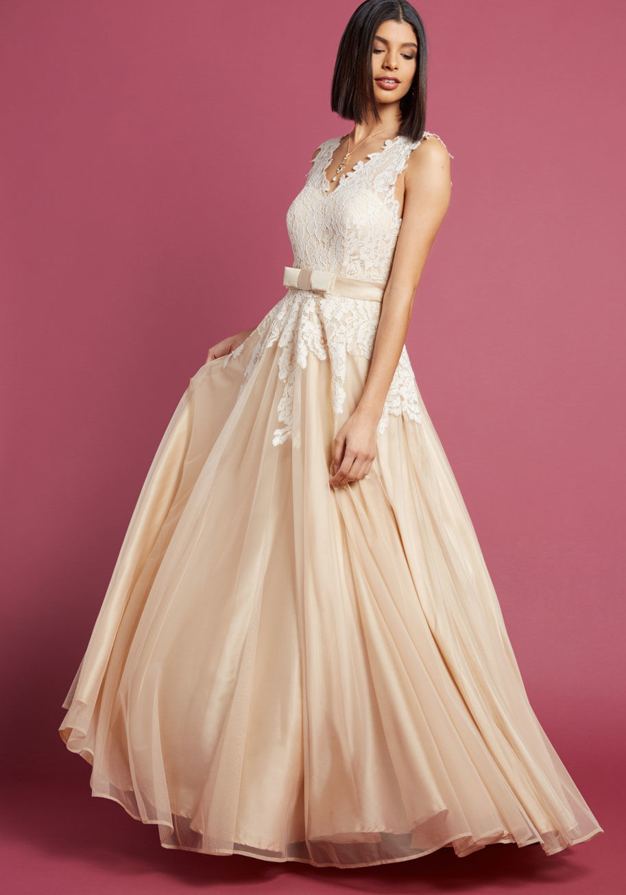 MDD1220 - Each ethereal detail of your special day will be fondly remembered, including every element of this stunning gown from our ModCloth namesake label. Ivory floral lace provides elegant contrast to the satin waistline bow, beige underlay, layers of tulle, an