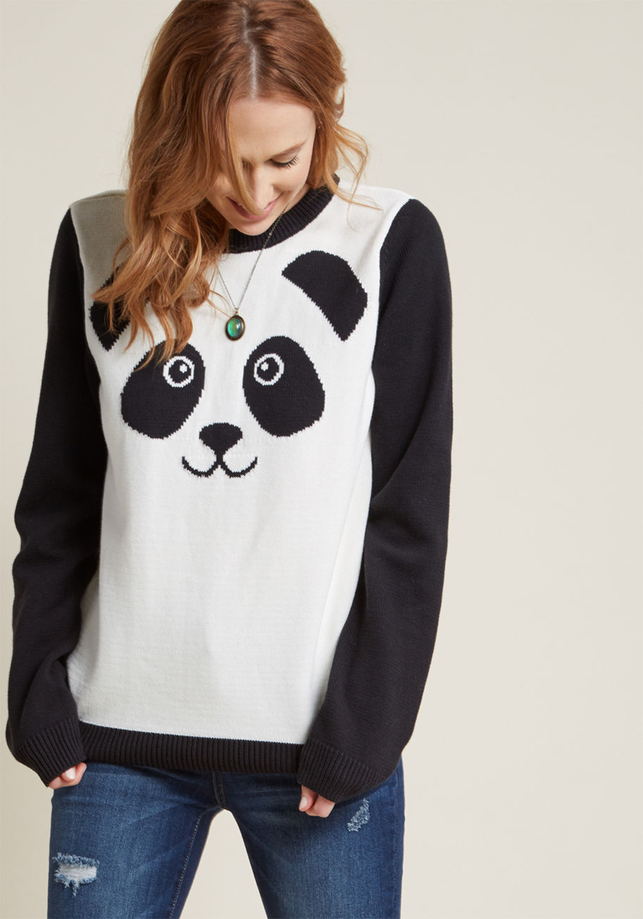 MDS1063 - Seen snuggled up just as often as it's spotted on the town, this black-and-ivory panda sweater welcomes friendly waves and bear hugs alike! Part of our ModCloth namesake label, this pullover features a contrast neckline, sleeves, and hemline framing its c