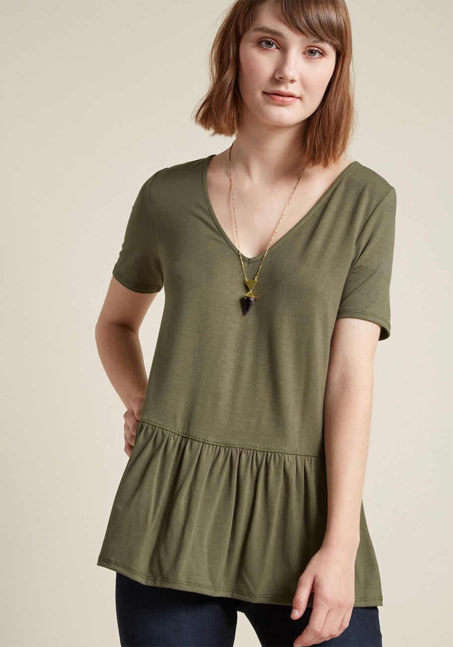 MDT1038 - That rockin' ensemble you pieced together starring this olive green top will have others thinking it took all morning to craft, but only you know it was a cinch to achieve! Elevating the basic V-neck tee with pretty peplum, this ModCloth exclusive makes i