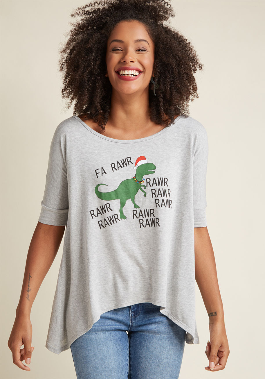 MDT1063H - Sure, Santa's the star of the season, but the caroling T-Rex printed on this grey graphic T-shirt is the real MVP! Rocking a wide neckline, half sleeves, and a shark bite hem, this festive ModCloth-exclusive tee makes the season so much more fun.