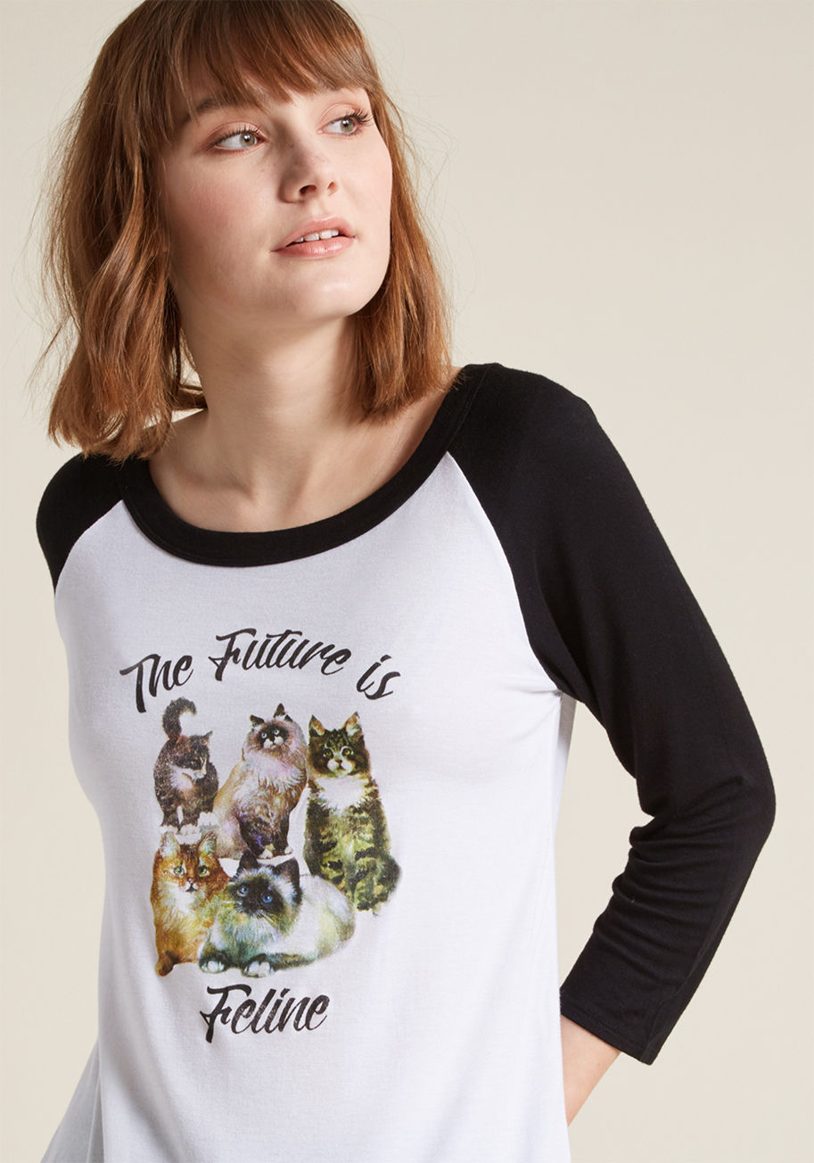 MDT1090C - Your gal pals show you the support you need to feel empowered - now it's time to rock this raglan top so your cat feels 'emp-meow-ered'! A ModCloth-exclusive tee designed with a bateau neckline, black 3/4-length sleeves, and a distressed screen print, thi