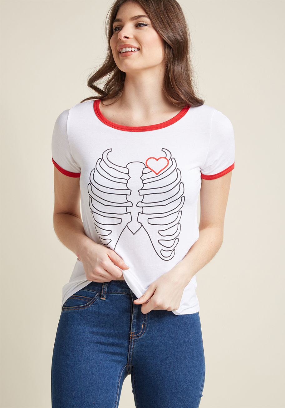 MDT1091B - Score this semi-sheer, white ringer tee and keep skeletal style alive! Rocking red piping and a coordinating heart propped atop a black ribcage, this ModCloth-exclusive shirt provides the framework for all sorts of fun, casual ensembles.