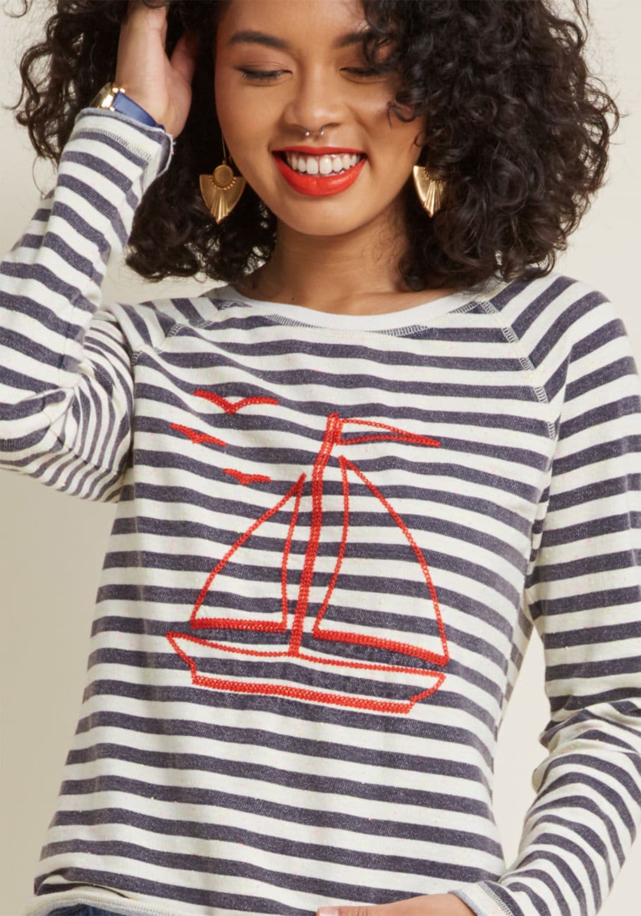 MDT1191 - In the absence of the sea breeze, take strides to maintain an oceanic vibe by wearing this quirky raglan top! This ModCloth-exclusive pullover flaunts neon yellow-and-pink flecks among its charcoal-and-ivory stripes, a red, embroidered sailboat, raw edges