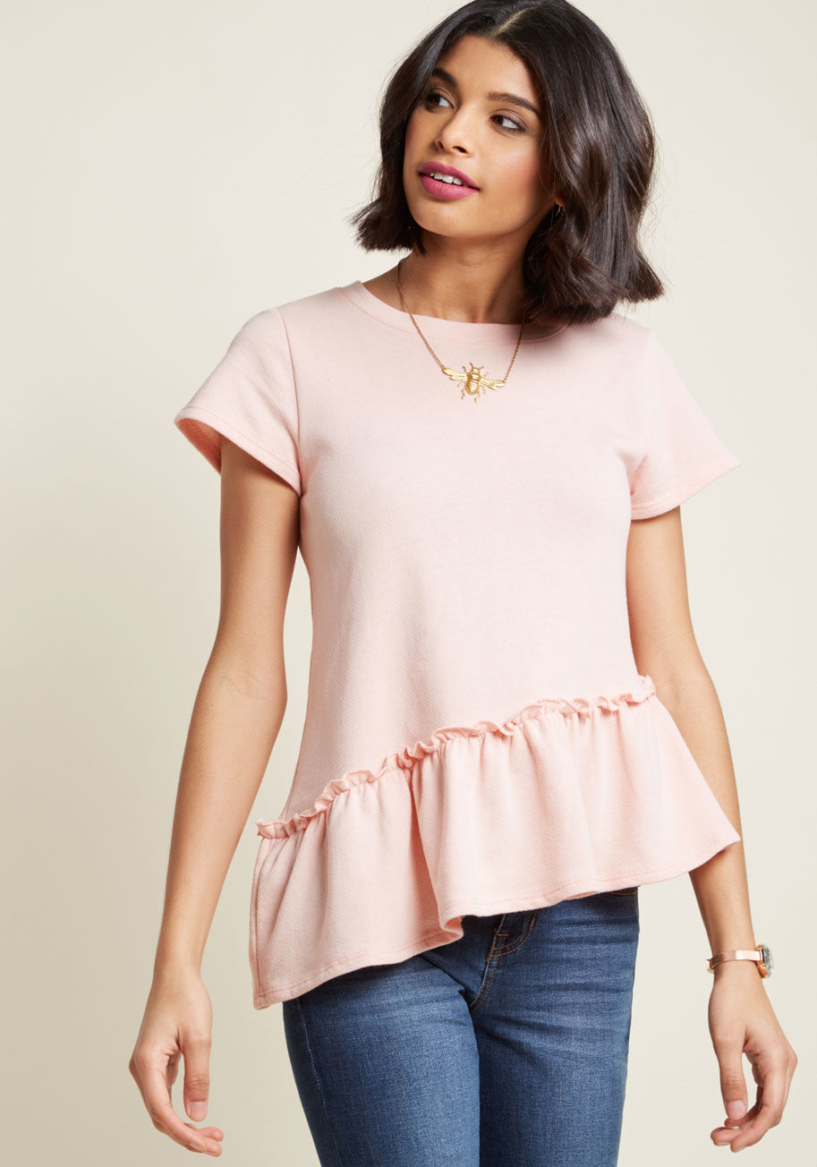 MDT1196 - Playing up the proportions of this soft pink top is our idea of an excellent time! Once you discover this ModCloth-exclusive top's French terry fabric, sweet short sleeves, and asymmetrical, peplum-style hem, we have a feeling you'll agree with us complet