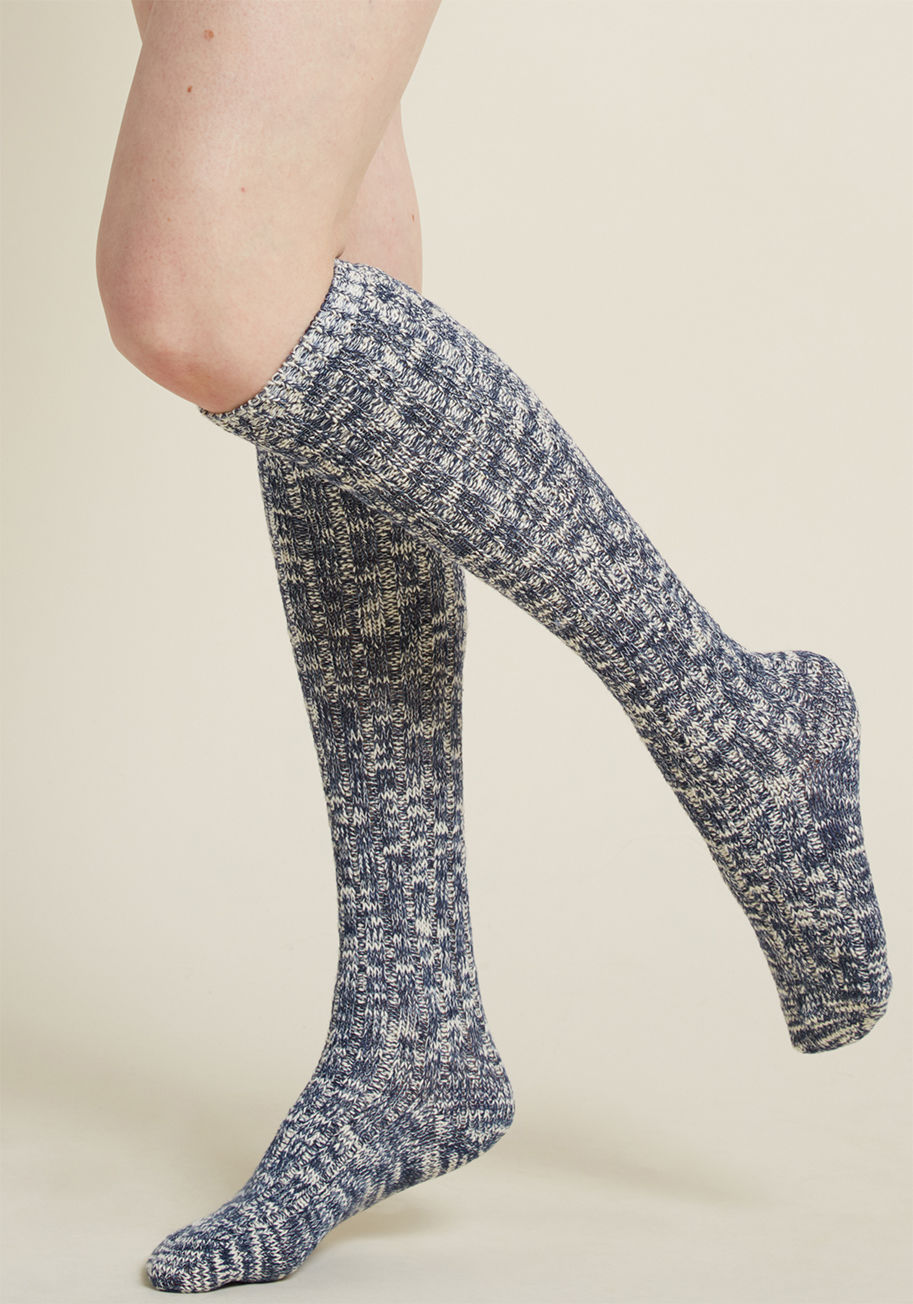 MK1502 - Looking to set an example of sweet style? Start with these knit knee socks! Mottled with a classic palette of navy and ivory hues, this pair is a simple way to show everyone how charming the right hosiery can be.