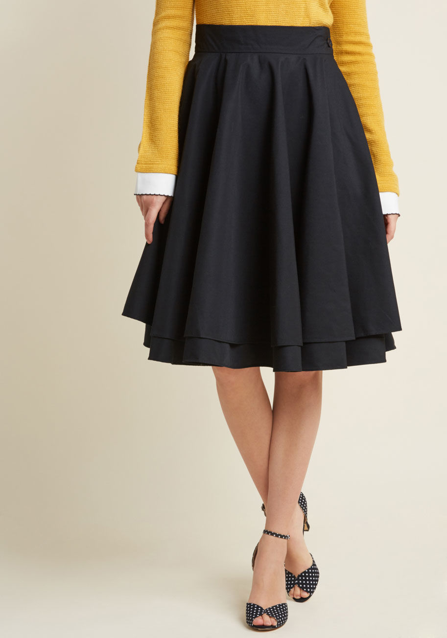 MSB1056 - An elegantly full skirt is the perfect accompaniment for a variety of ensembles, making this basic - but hardly boring - black skirt a sartorial must-have. This ModCloth-exclusive bottom features a lovely, double-tiered drape, a fitted waist, and endless 