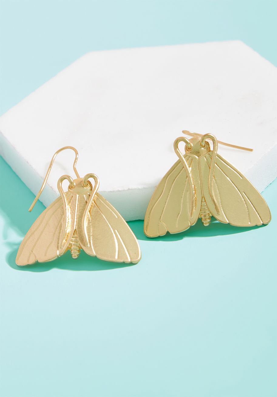 MTM05-1103 - Oh yes, you read that correctly - these gold earrings are proudly named after this beloved institution. The moth-shaped silhouettes of this quirky pair are exclusive to ModCloth, so such a title would only be fitting! There are no other darling danglers t