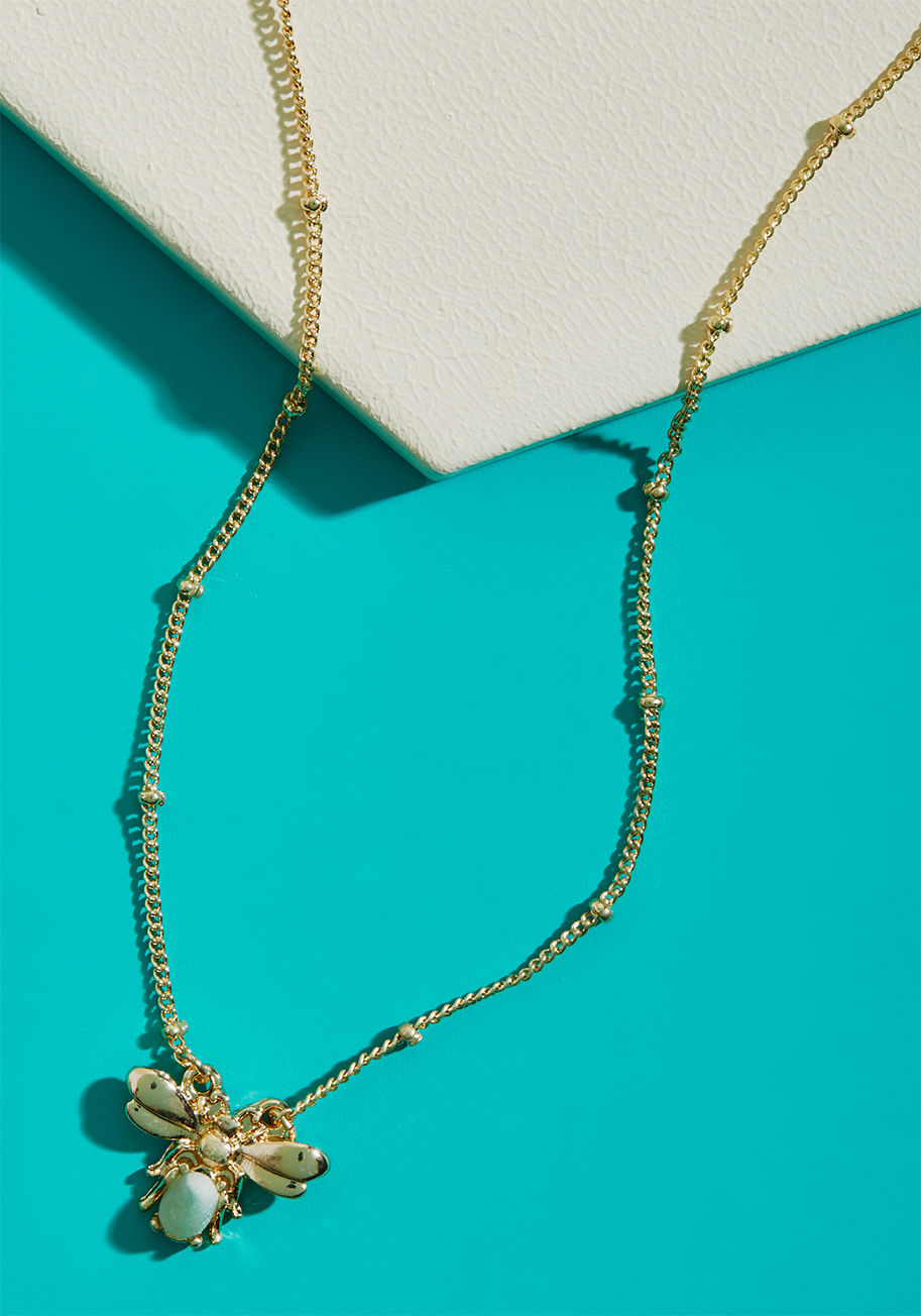 MTM07-1126 - Seeing how adorable your outfit looks with this gold necklace polishing it off will have you dancing with joy! A ModCloth exclusive, this delicate accessory touts a bee-shaped pendant with a jade-hued faux stone that'll get you feeling 'hive' and mighty.