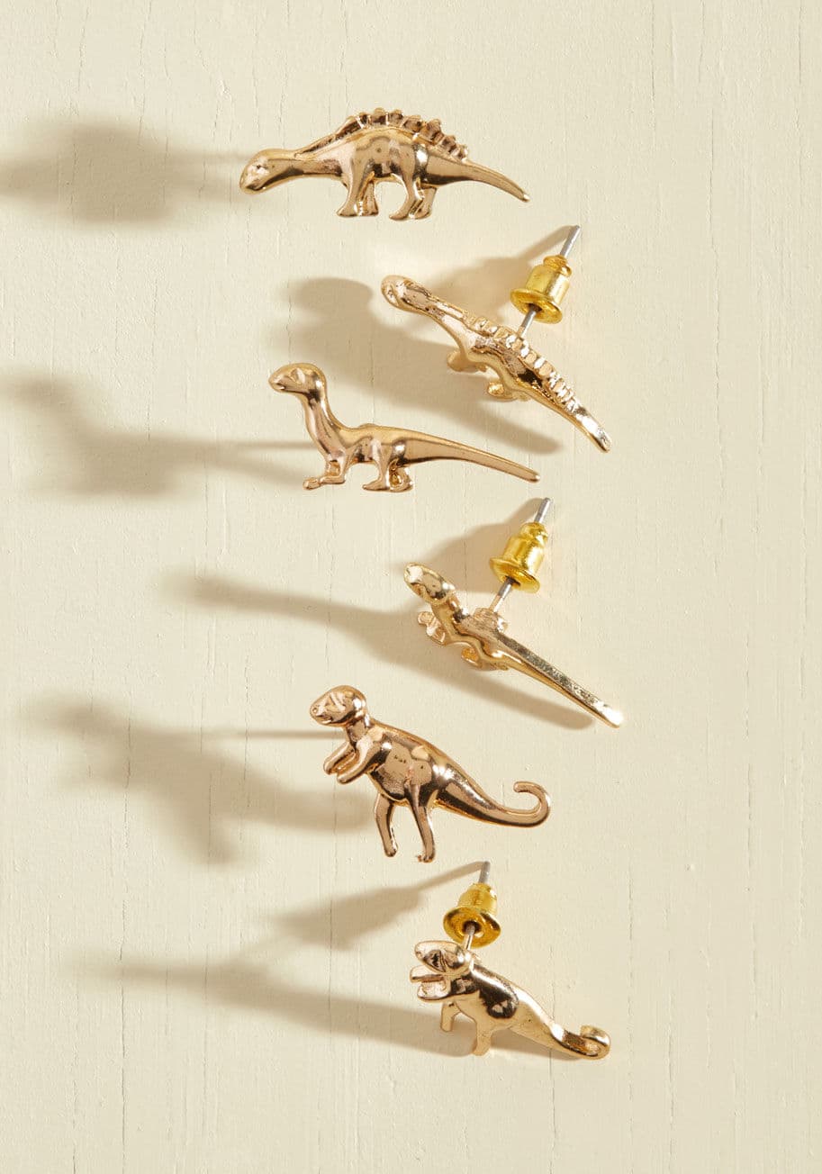 MTM20109 - Are these gold earrings cute or what? A trio of prehistoric wonders, including a T-rex, Brontosaurus, and Stegosaurus, makes this set a timeless combo that's an absolute hit!