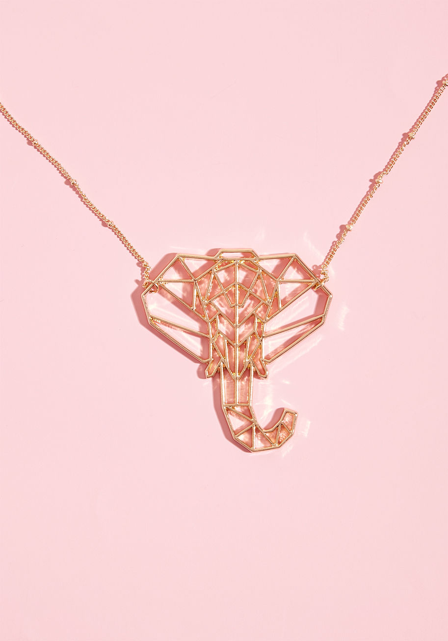 MTM4134 - As soon as you slip this gold elephant necklace over your head, your look becomes awash