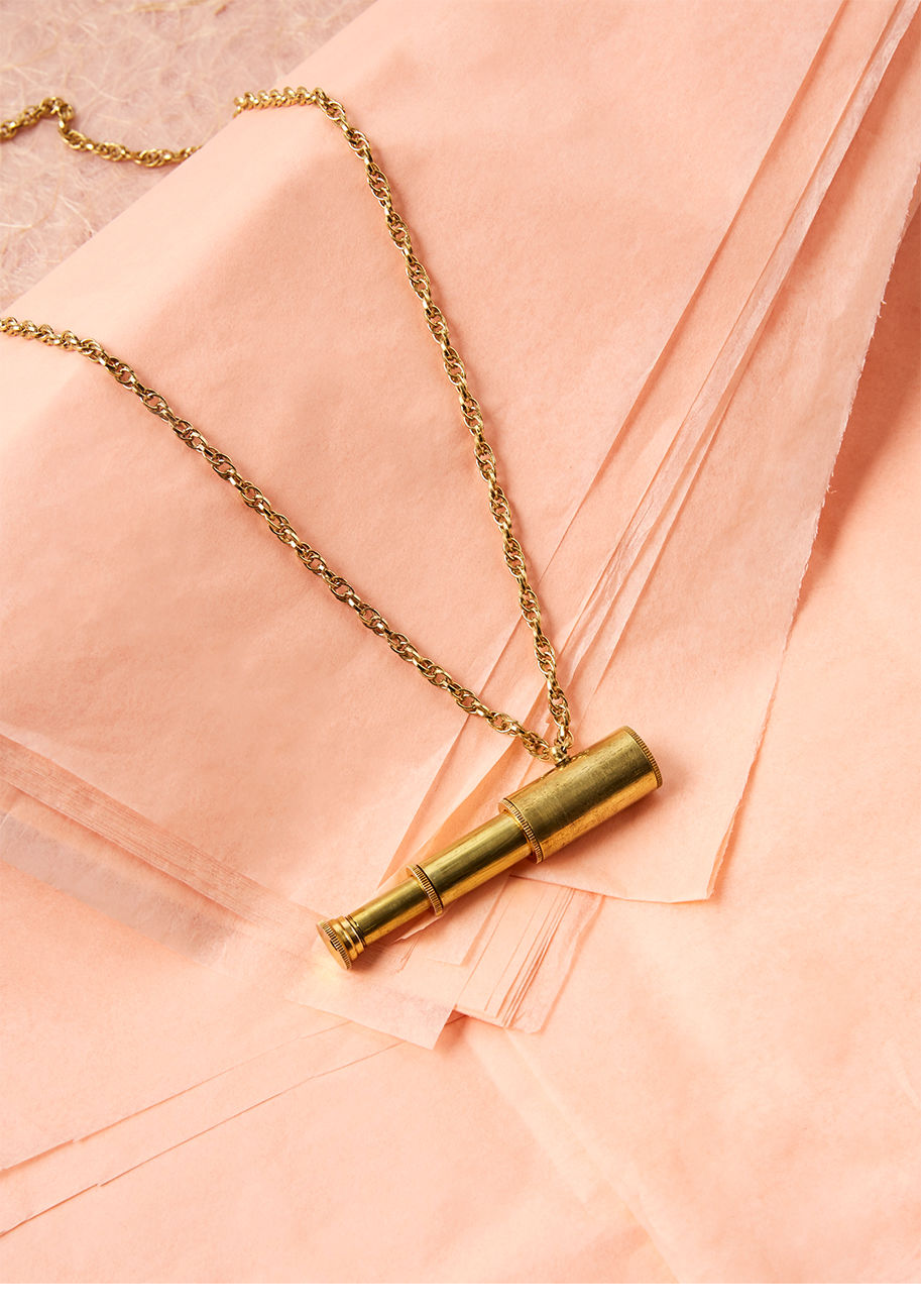 N1659 - With this gold pendant necklace gleaming atop your favorite tee, you let everyone know you've got the deets on it all - near and far! A functional, retractable telescope imbues this accessory with chic uniqueness, and empowers you to explore new depths an