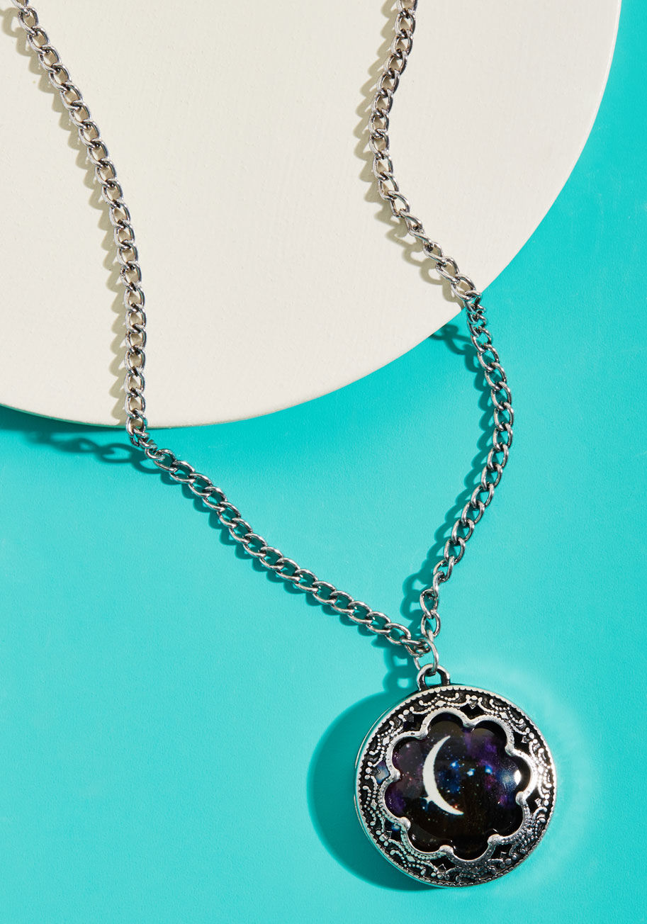 N5213SV - Now you can indulge your night owl side during daylight hours by sporting this silver pendant necklace! Inside the precious charm of this pretty piece is a slice of the night sky surrounding a crisp crescent moon, making celestial style a 'round-the-clock