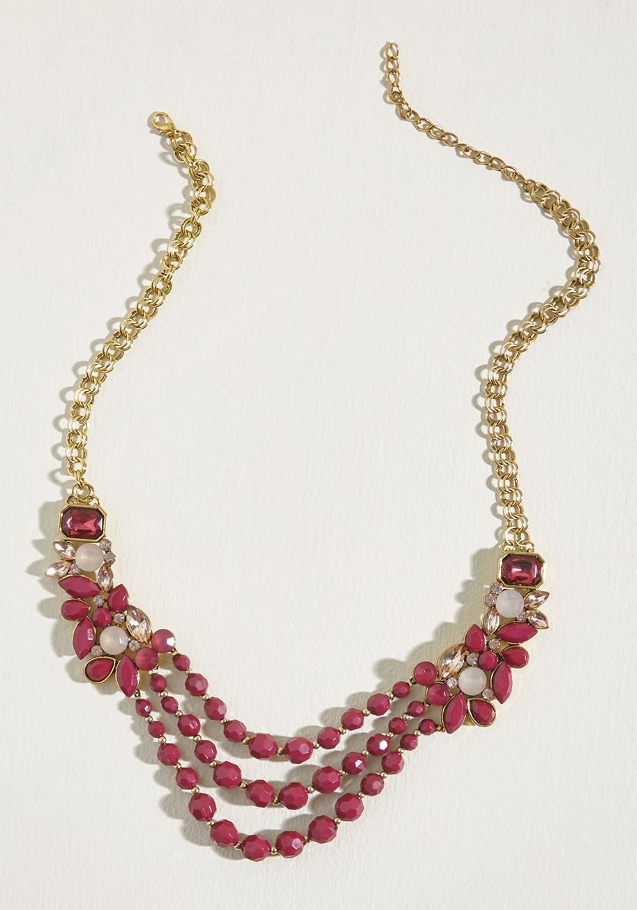 NA66471R - Pulled-together is the only option for this statement necklace! Supported by a double gold chain, clusters of berry and rose faux gemstones collect