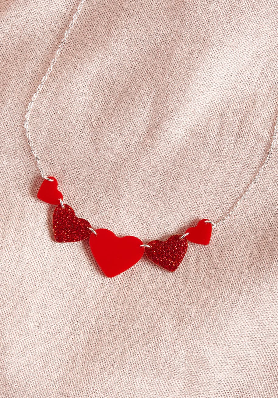 NSP_5HRT_01 - No need to be coy with your desire to flaunt this heart-detailed necklace from Vinca - it wants you just as much! There's nothing quite like requited accessorizing, so go on and do up those collarbones with the sparkles, gloss, and silver accents of this 