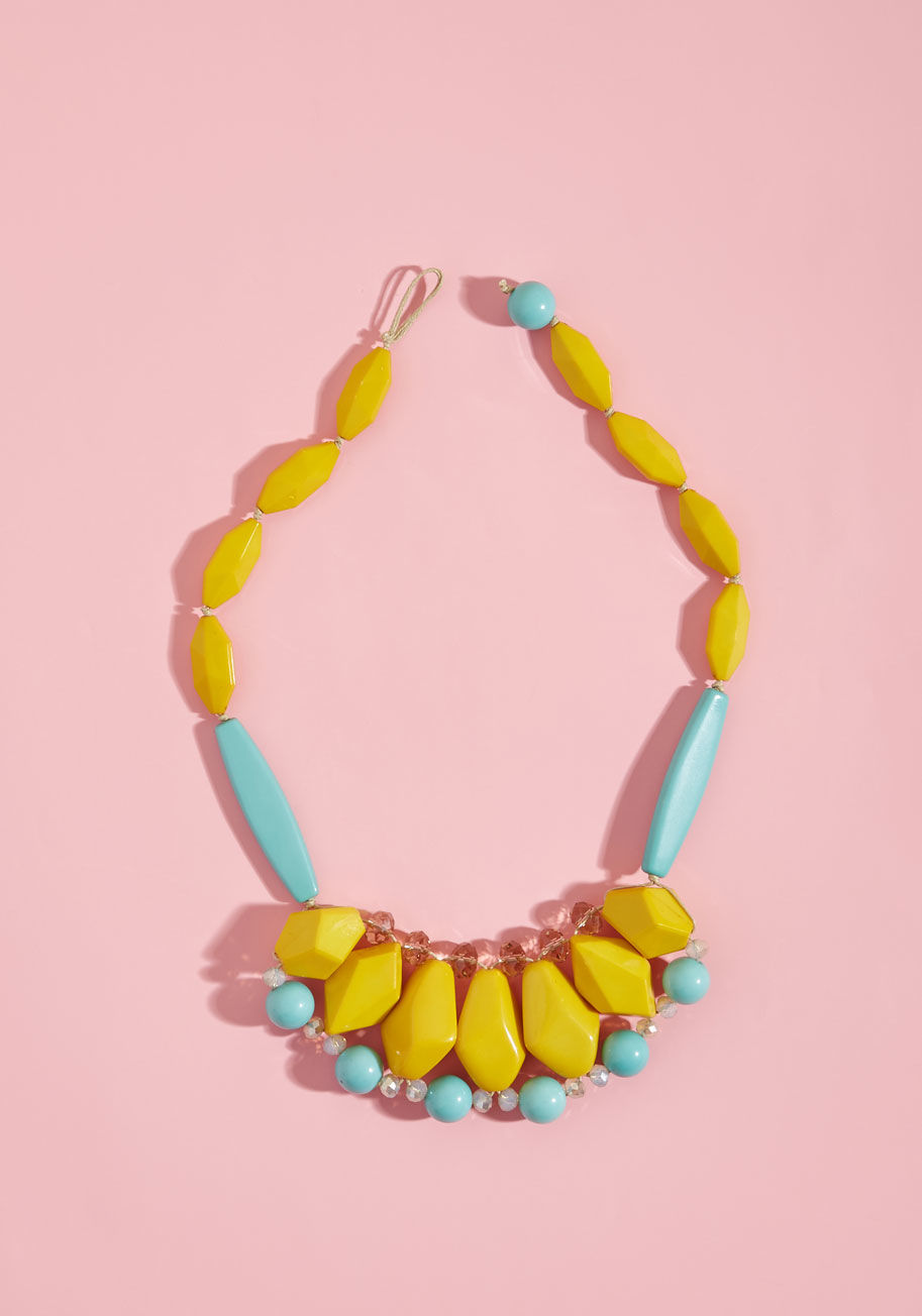 RSN0021-YLMT - Even when your chosen outfit for the day is on the simple side, this beaded necklace ups the intrigue and celebrates your spunky taste! Combining shiny facets, glossy finishes, and a palette of curry, aqua, champagne, and iridescent hues, this geometric a