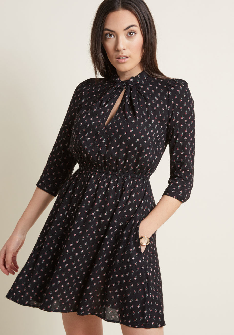 Shalora Ditsy - This black dress is all it takes to compel a charming lifestyle! A lovely 3/4-sleeved A-line from UK-based brand Louche, this gold-zipped number gives femininity a good name. The playful details of this piece include a twisted high neckline, front keyhole