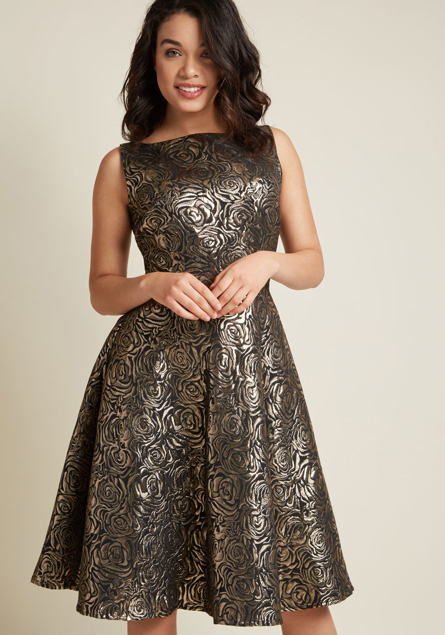 Silver Roses - When it comes to this floral party dress from Tatyana, all that glitters is bold! The glistening, metallic gold roses on this black fit and flare really wow, especially when they're paired with this look's scooped back and mid-length skirt. Talk about a l