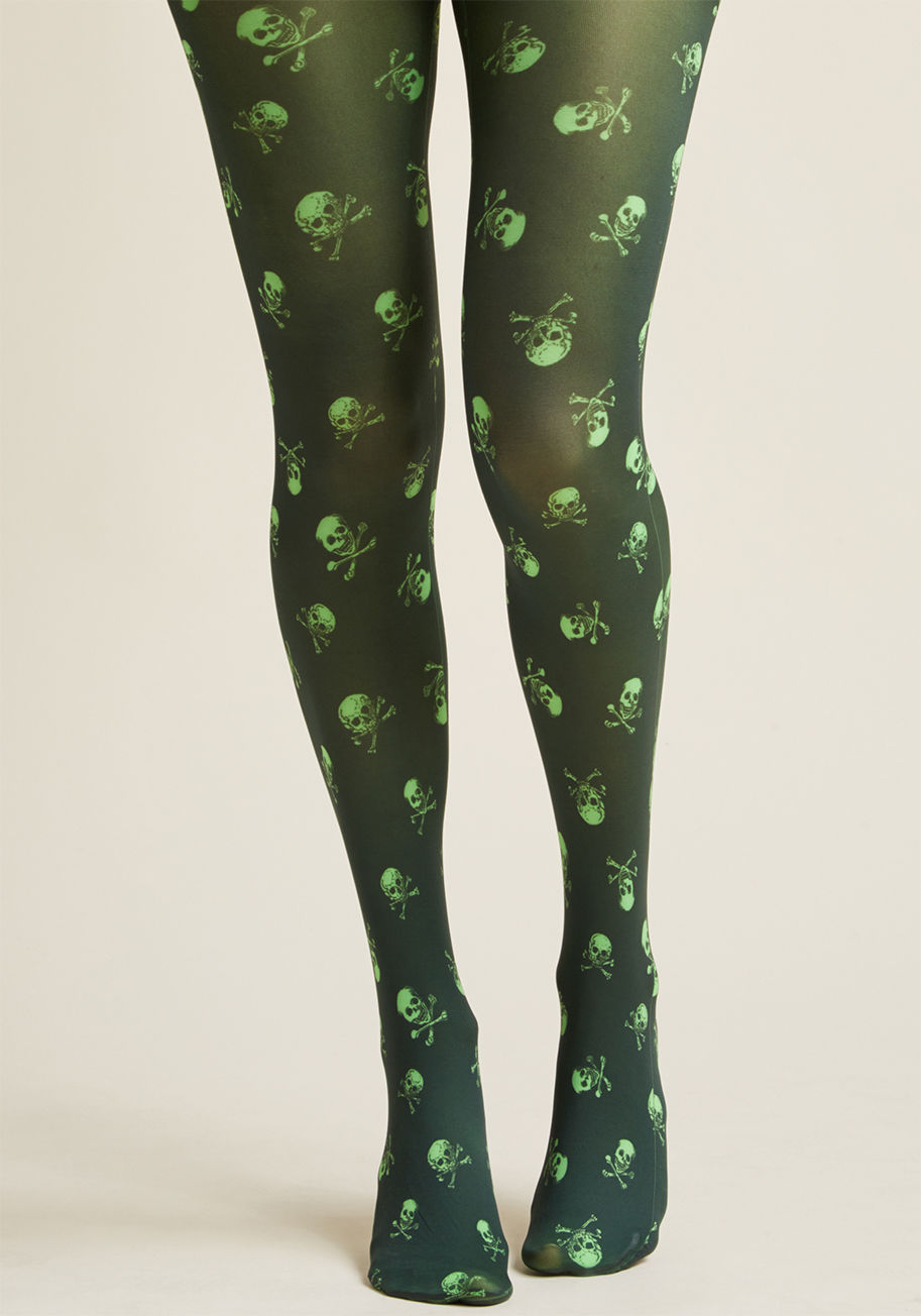 Skulls B printed tights - It's been awhile since you've rocked macabre moxie, but these black tights make it easy. Flaunting fluorescent green skulls and crossbones, this statement-making legwear reintroduces spooky style into your wardrobe!