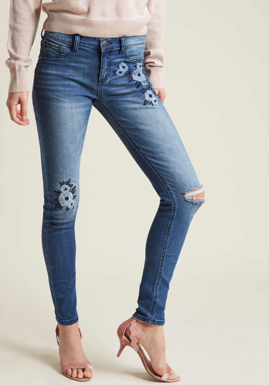 SP-P9642 - The stars don't hold the answer to the coolest pair of skinny jeans around, but we sure do! This mid-wash pair indulges your desire for details with its strategic distressing, feminine, floral embroidery, and the perfect splash of stretch, so halt your wi