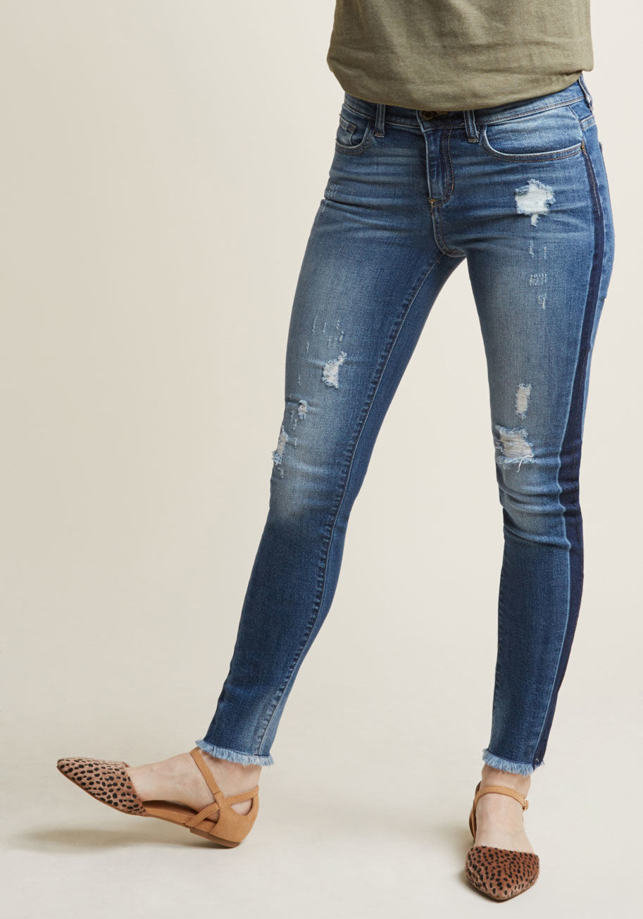 SP-P9693M - These skinny jeans may be distressed, but you sure aren't while pairing 'em up with your favorite pieces! Styling the darkened side seams, frayed hems, and stone wash of this slightly-stretchy pair is an absolute breeze for an imaginative stylista like yo