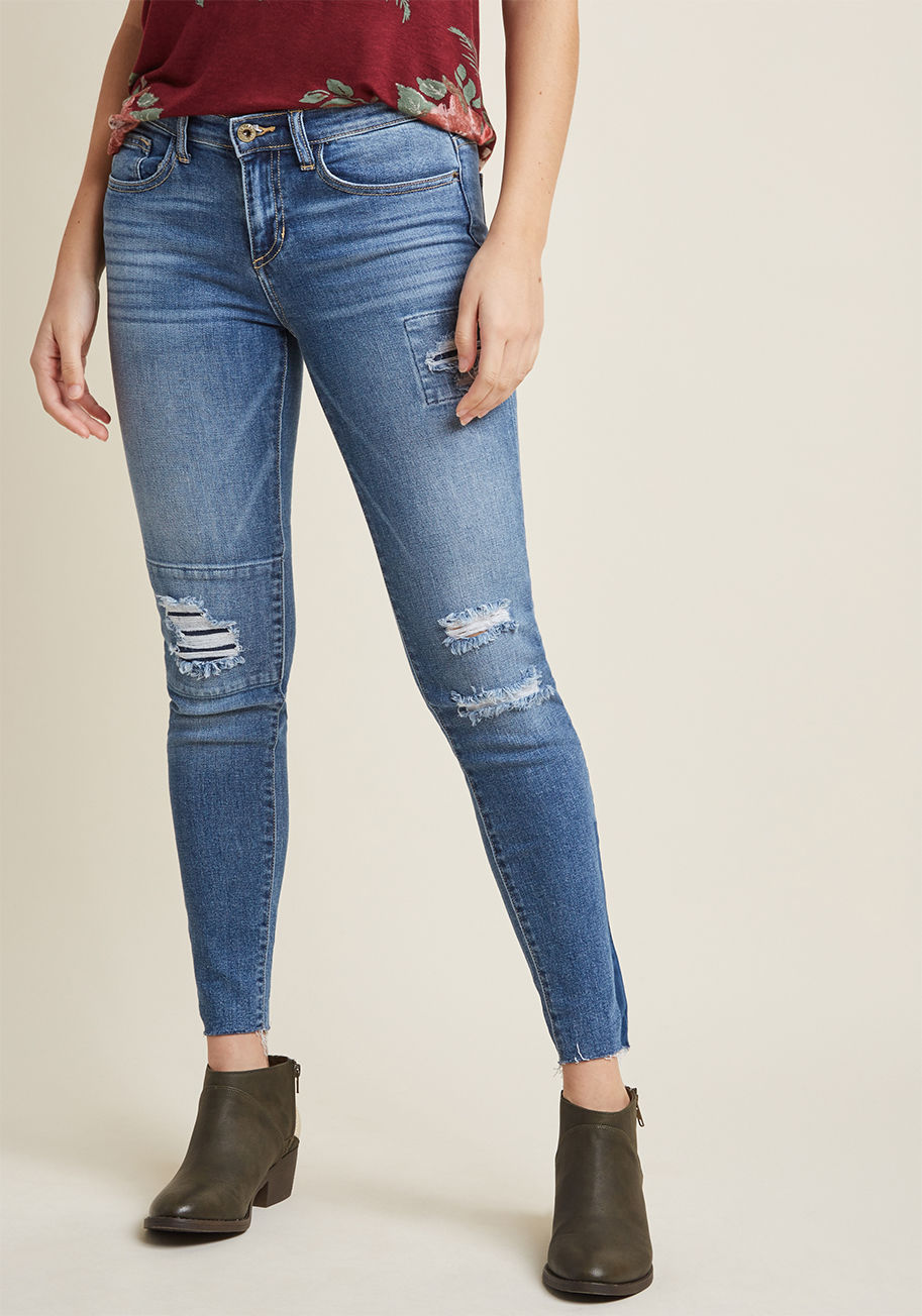 SP-P9711MD - Distressed skinny jeans that can keep up with your daring day-to-day? This pair is it! Elevating basic tees and chunky sweaters with their mid rise, light wash, strategic tears, and raw hems, these stretch-touched stunners promise to perform whenever the 