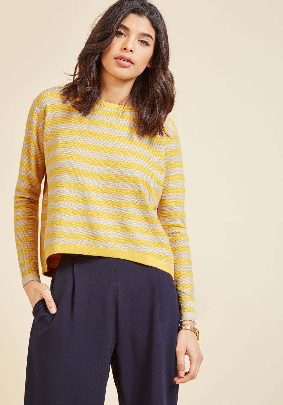 Sp17chu08 - Having some doubts about taking the plunge on this yellow sweater from Compania Fantastica? We recommend taking a sec to envision your slacks, skirts, shorts, and more pairing perfectly with the taupe stripes, high-low hem, and textured knit of this cool 