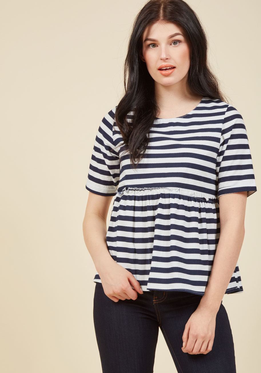 Sp17pic02 - Do you love a fluttering hem, a subtle hint of femininity, and stylish sweetness? Then, this navy and white top from Compania Fantastica is a must-have! The exposed, ruffled seam of this half-sleeved blouse only adds to its charm, making this striped pepl