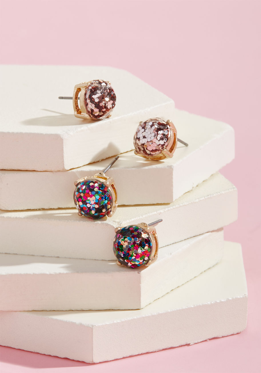 SSE-5222 - It&rsquo;s about all you can &lsquo;luster&rsquo; to not grin from ear to ear when you&rsquo;re sporting these sparkling studs! Made to catch the eye with gold frames and a combo of rosy 'n' multicolored glitter, these earrings are definitely something to