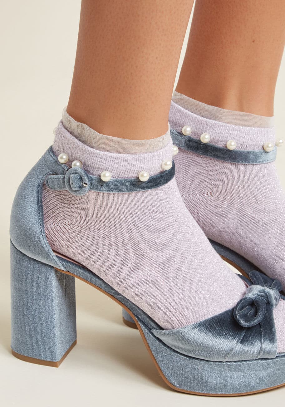 Style 2 - Precious protectors of your posh style, these lavender ankle socks are delightfully feminine! Woven with metallic silver threads and magically trimmed with faux pearls, this spiffy pair will look out for your standout style, ensuring it's seen and believe