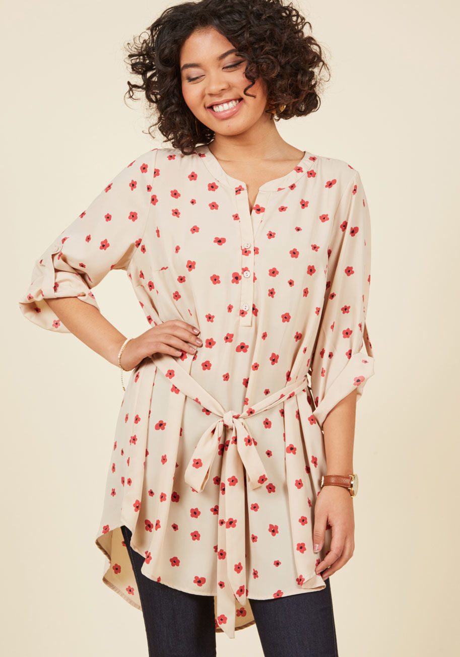 T311-02 - This tan tunic is always on double-duty, acting as a piece that's equal parts fun and functional! Perfect for daytime with its tab sleeves and buttoned V-neck, this ModCloth-exclusive top also flaunts a flirty matching sash and lovely red flowers that eff