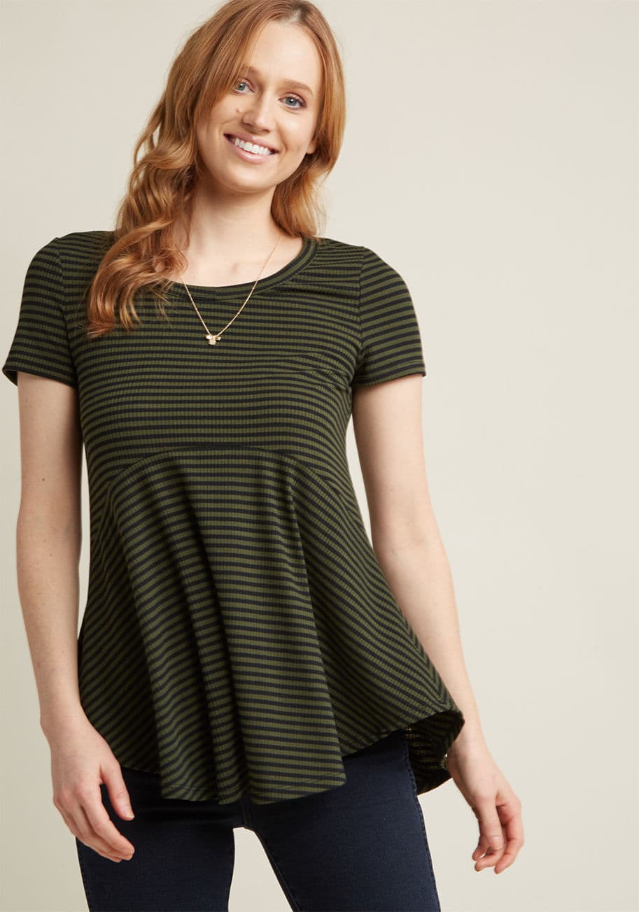 T332-03 - Your plan to sport this short-sleeved shirt at the first available opportunity isn't a maybe - it's for sure! Rocking black and olive stripes, a scoop neckline, and a flowy panel at the waist, this ribbed knit tee is a total keeper.